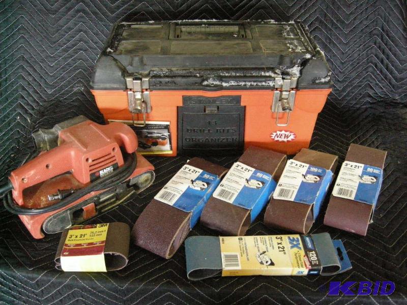 lot 101 image: Black & Decker sander, sandpaper, toolbox