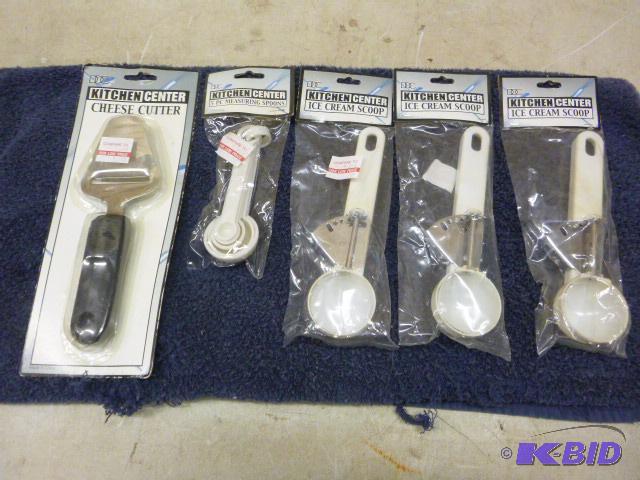 lot 121 image: Cheese Cutter, Measuring Spoons, and Three Ic...