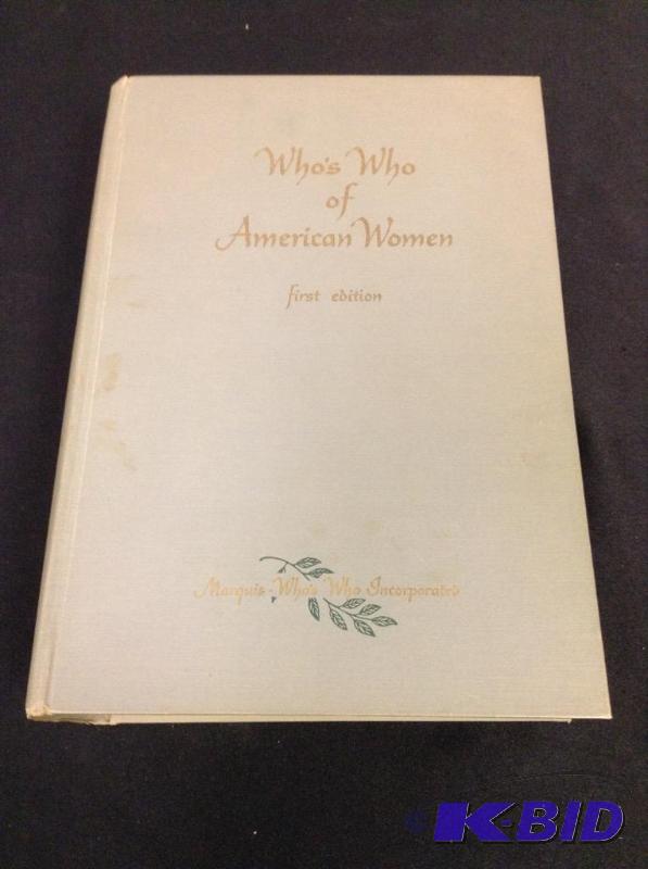 lot 21 image: Vintage book Whos Who of American Woman First Edition with newspaper clipping