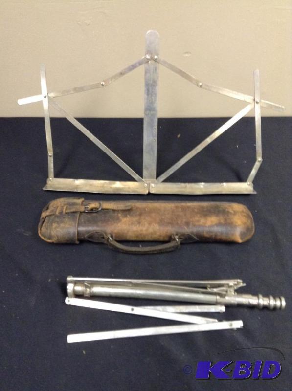 lot 44 image: Vintage music stand and leather storage case.
