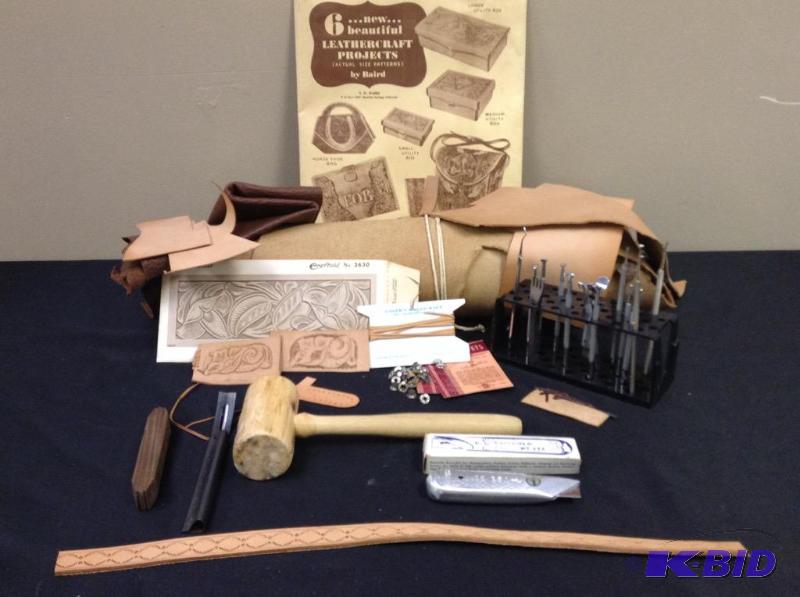 lot 66 image: Leather crafting items, knife, scrapers, punches, leather, rivets, hammer, needle