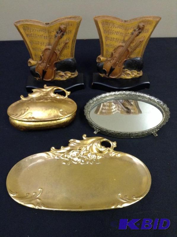lot 79 image: Lot of wood violinmusic bookends, vanity mirror, gold ceramic vanity set