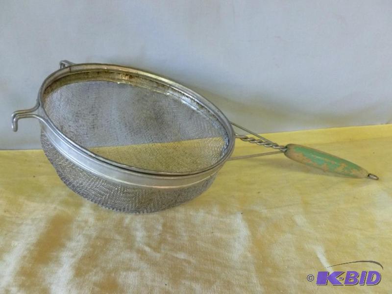 lot 21 image: Large vintage green wood handled kitchen stra...