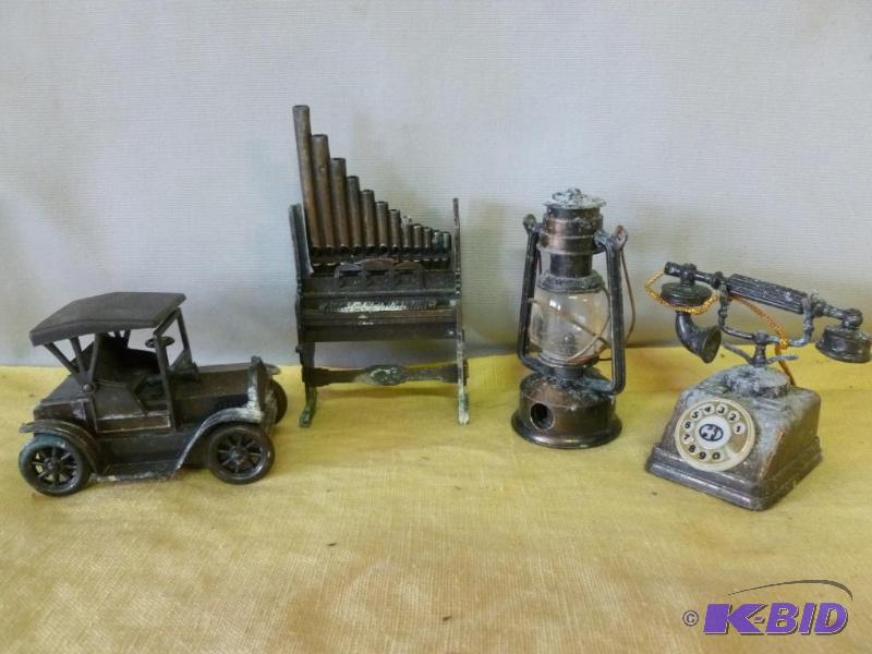 lot 44 image: Lot of four collectible die cast metal pencil...