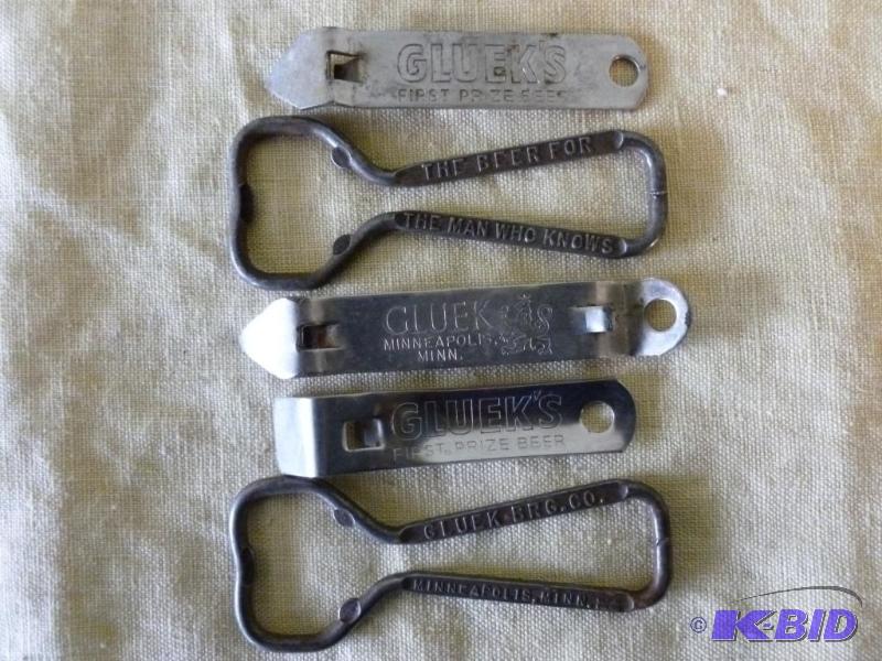 lot 58 image: Lot of five vintage Glueks metal beer bottle...