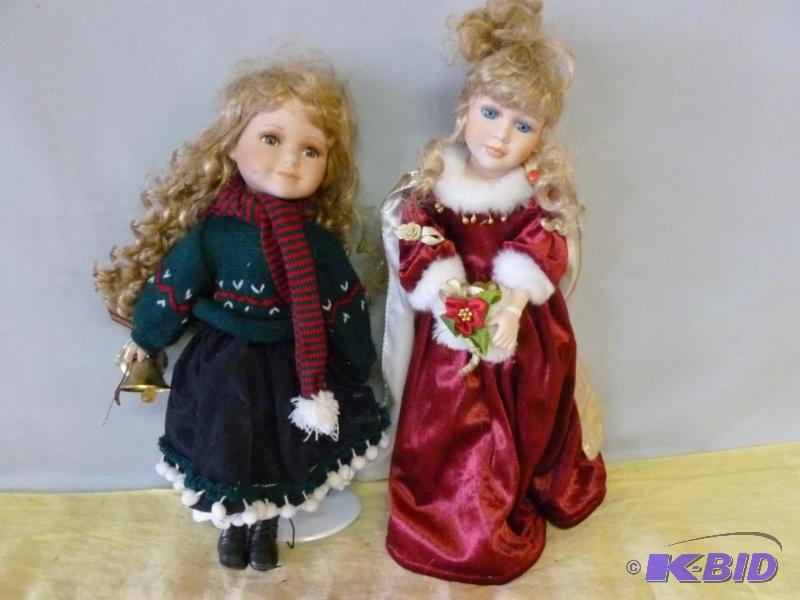 lot 89 image: Lot of two collectible porcelain dolls on met...