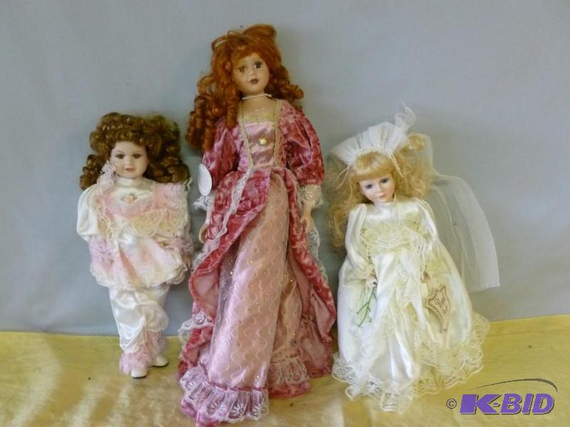 lot 91 image: Lot of three collectible porcelain dolls....