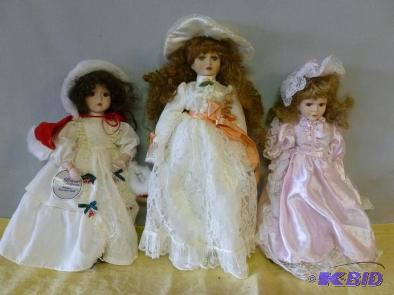 lot 92 image: Lot of three collectible porcelain dolls....
