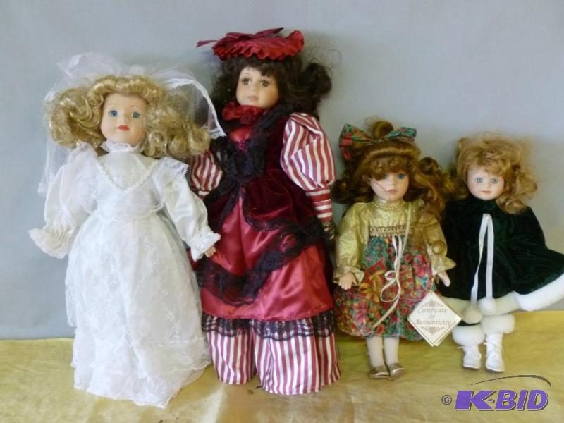 lot 93 image: Lot of four collectible porcelain dolls....
