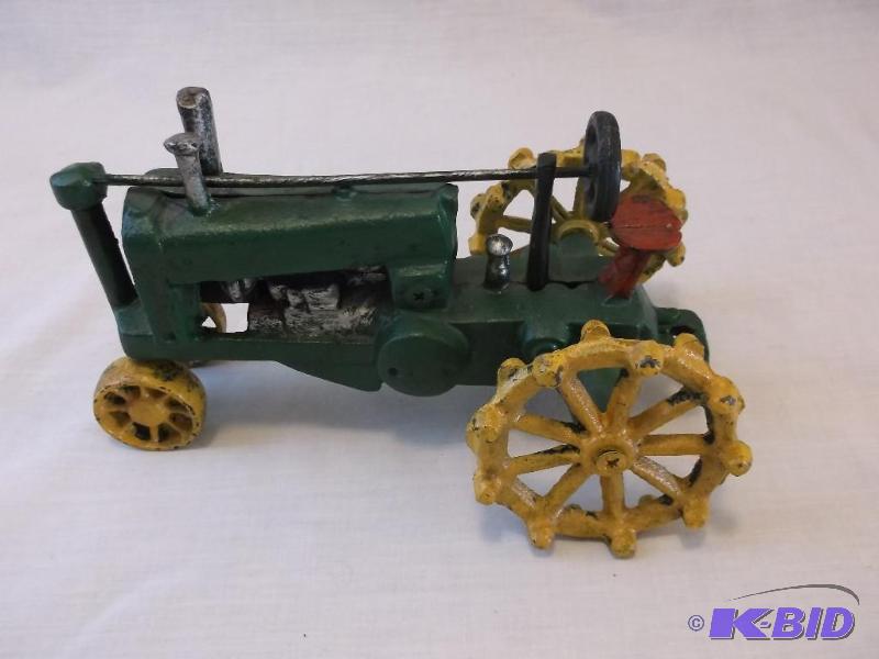 Collectable cast iron toy tractor measuring 8...
