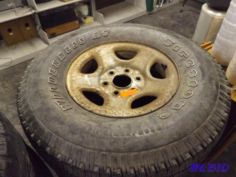 lot 231 image: One Firestone tire - good for spare, good tread