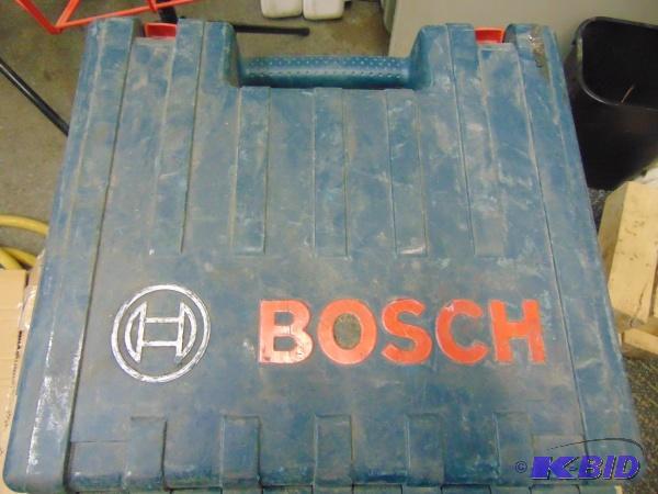 lot 56 image: Bosch Hammer Drill   Comes with chuck and cas...