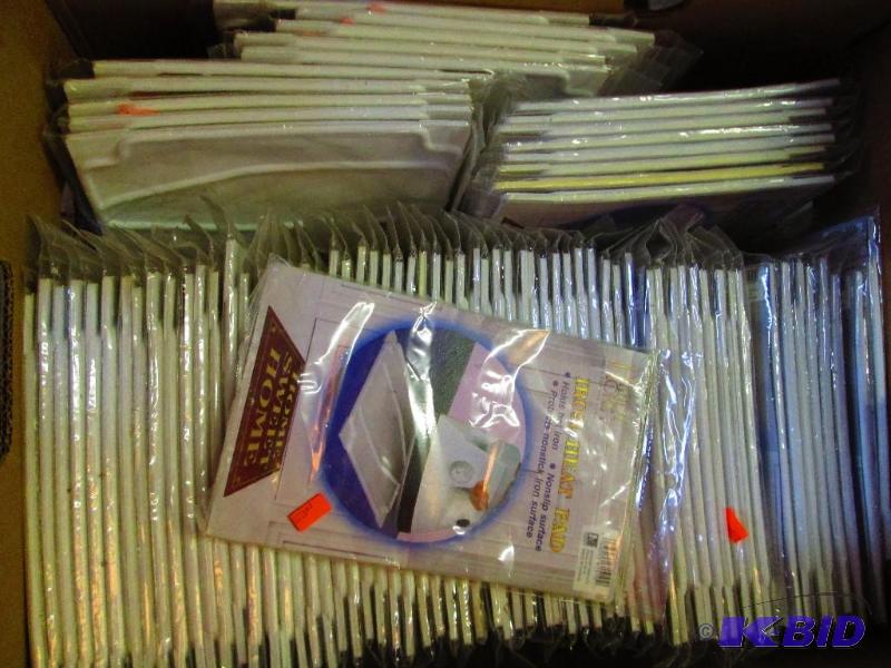 Banana box of Handy Home iron heat pads...