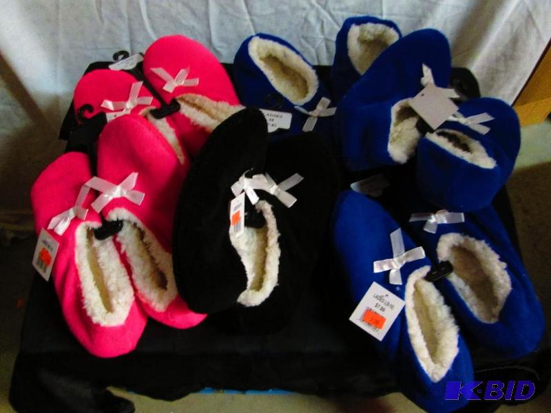 six pairs of womans fluzz slippers sizes 7-8...