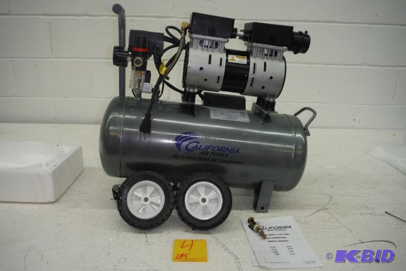 lot 4 image: California Air Tools CAT-6310 Ultra Quiet and Oil-Free 1.0 Hp 6.3-Gallon Steel Tank Air Compressor, New Works great Super Quiet, Missing one bolt for wheel, see picture