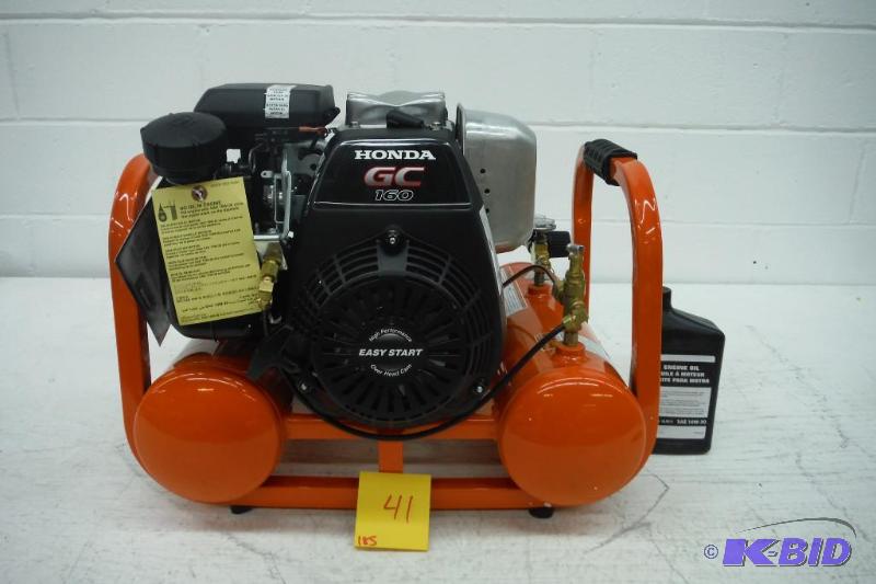 lot 41 image: Industrial Air Contractor CTA5090412 4-Gallon Grade Direct Drive Pontoon Air Compressor with Honda Ethis Item is Brand new but has two flaws Plastic handle is not attached and there is a dent in the thin plate covering top of head,