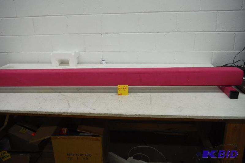 lot 64 image: The Beam Store Pink Suede 8-Feet Gymnastics Balance Beam- 34 tear on beam