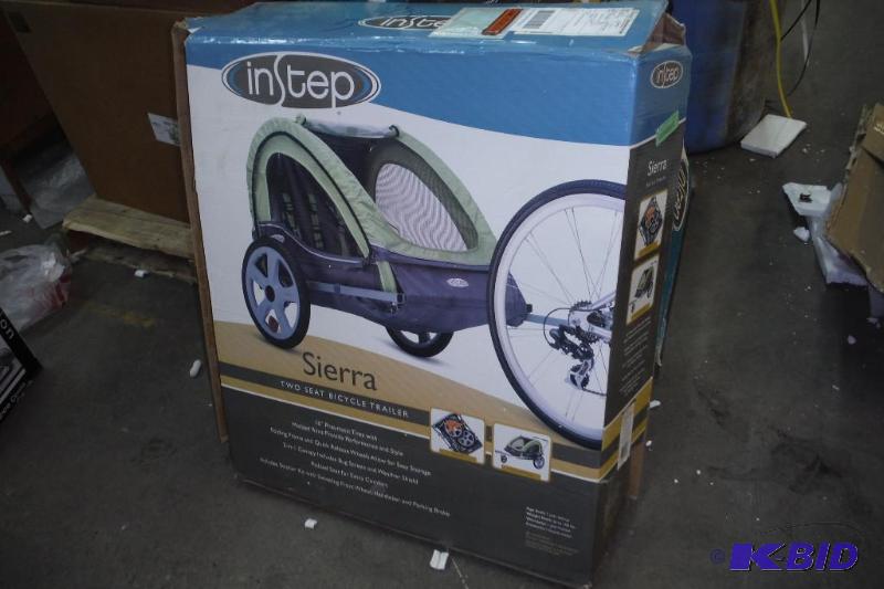 lot 86 image: Instep Sierra Double Bicycle Trailer W Folding Frame & Quick Release Wheels Allow For Easy Storage- Brand New in Box
