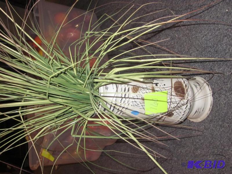 Artificial plant in metal vase.&nbsp  &nbsp...