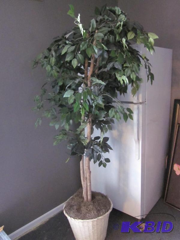 Artificial tree in wicker basket base.&nbsp ...
