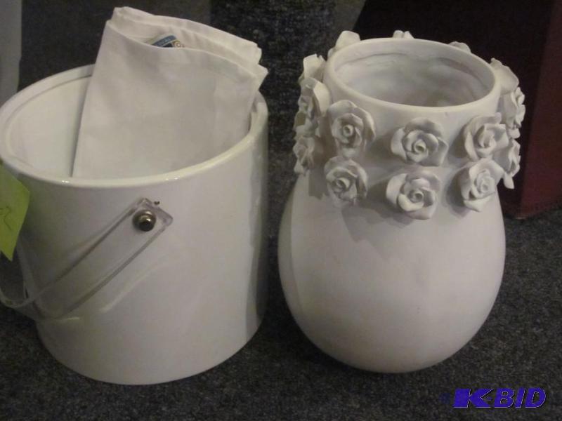 White ceramic vase and a white ice bucket wit...