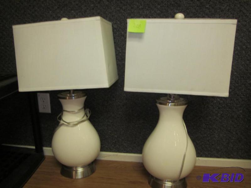 Pair of white ceramic lamps with shades.&nbsp...