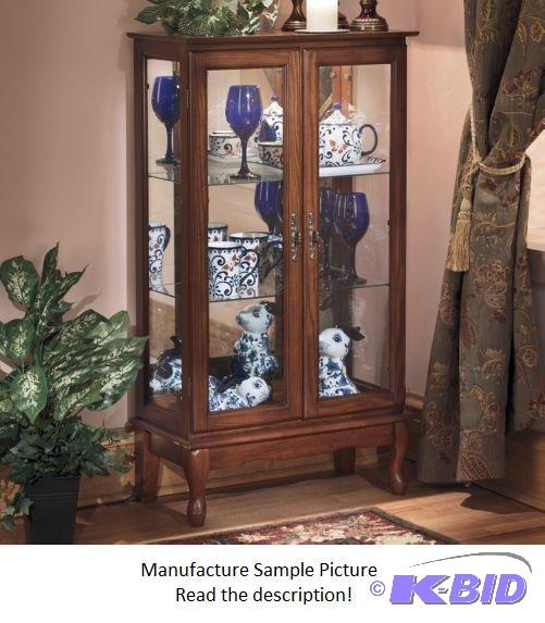 lot 53 image: Two Door Lighted Curio Cabinet -&nbspA state...