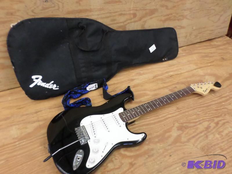 lot 97 image: Fender Squier Strat Guitar With Case...