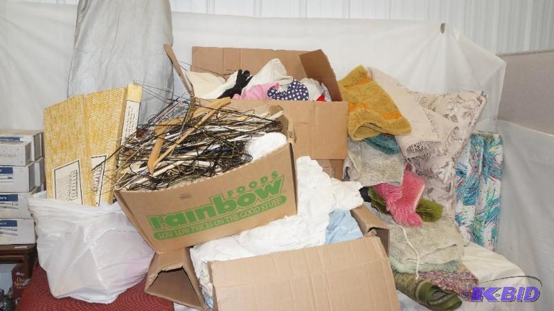 lot 126 image: Large Lot of Linens, Rugs, Clothes, Cushions, Ironing Board & More