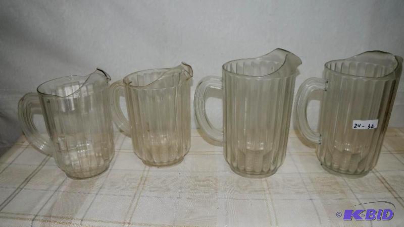 4 used plastic water pitchers in good shape....