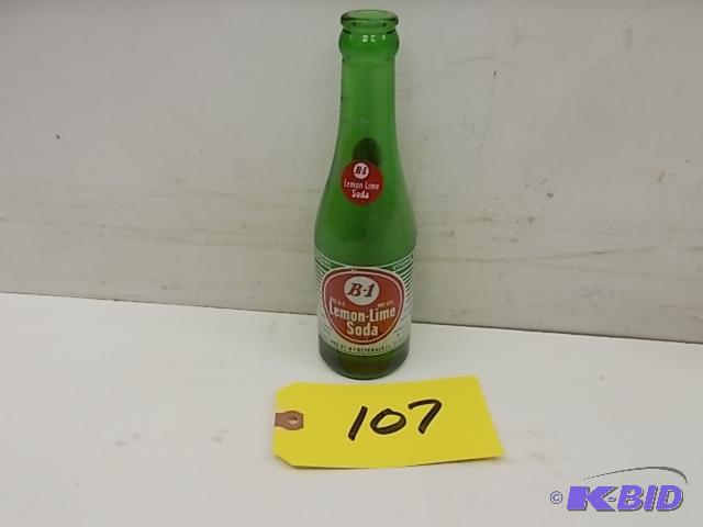 lot 107 image: B-1 Lemon Lime Soda 7 oz. Bottle...