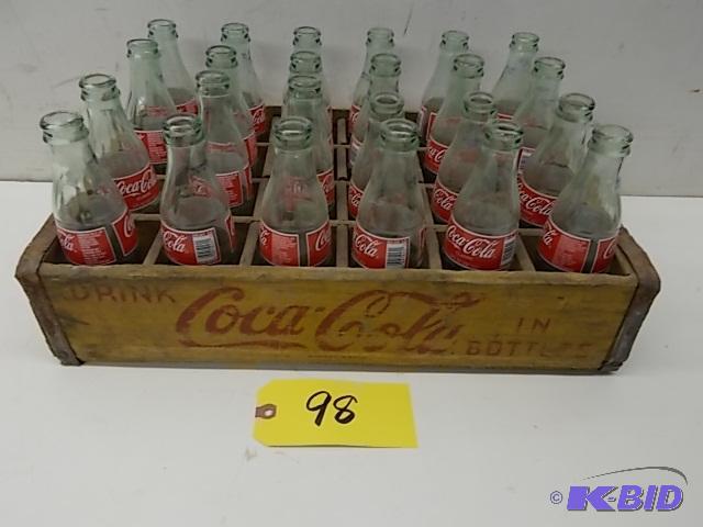lot 98 image: (24) 8 oz. Coca-Cola Bottles with Coca-Cola W...