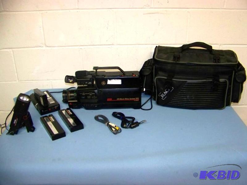 lot 53 image: GE, VHS, HQ Movie Video System including Camera, Light, Batteries, Charger and Carrying Bag