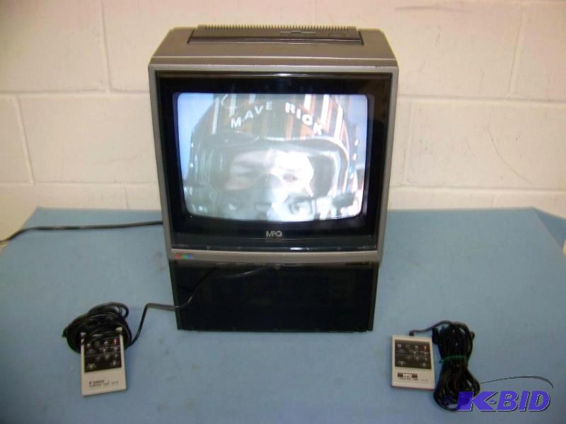 lot 82 image: NEC, 12, Color Video Monitor with Canon, Video Cassette RecorderPlayer (VCR) and custom Case