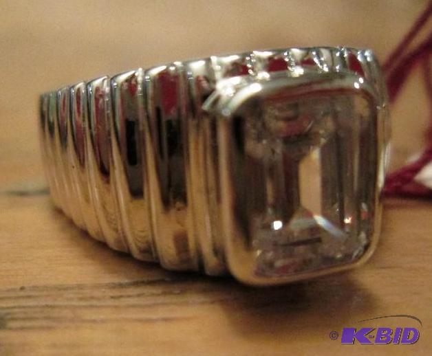 lot 110 image: Cubic zirconia in silver colored band...