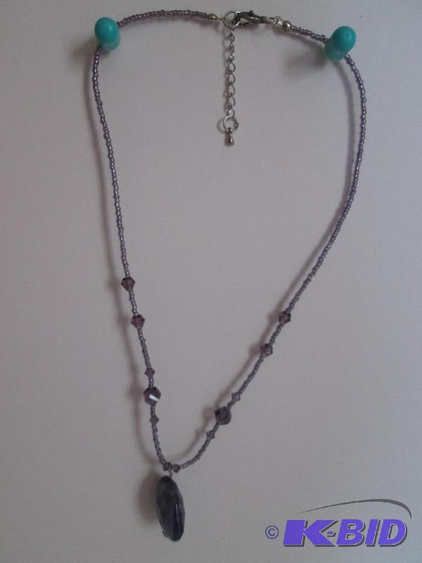 lot 23 image: purple beaded necklace...