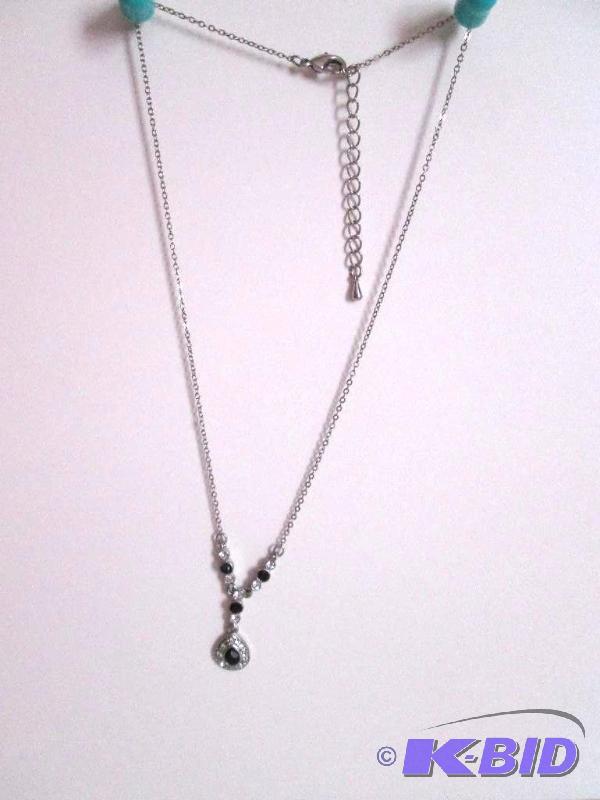 lot 81 image: Sliver colored chain with sliver and black pe...