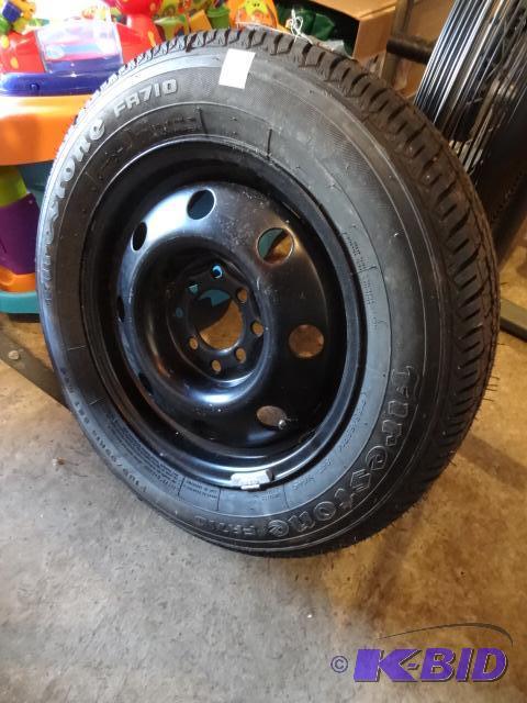 lot 37 image: FIrestone P185 65R14, New Tire. Universal Rim...