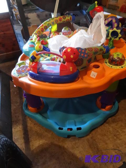 lot 38 image: Baby Exersaucer. Avent Baby Bottles...