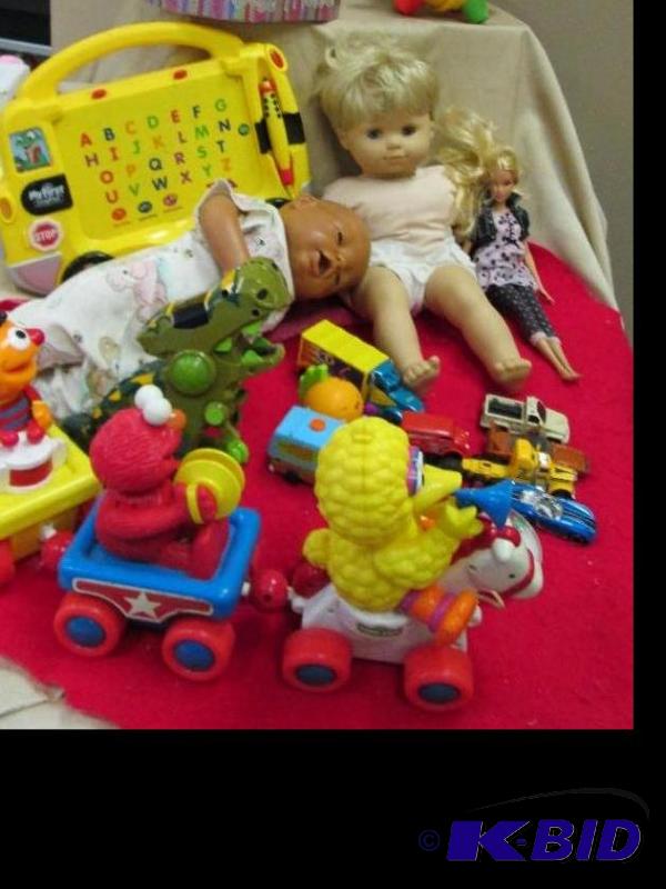 lot 25 image: Assortment of Toys like baby dolls, cars, My ...