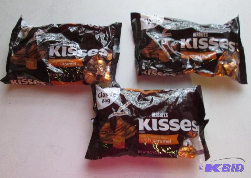 lot 253 image: 3 bags of carmel filled hersheys kisses...