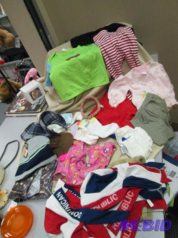 lot 51 image: Assortment of hats, infant socks, and other l...