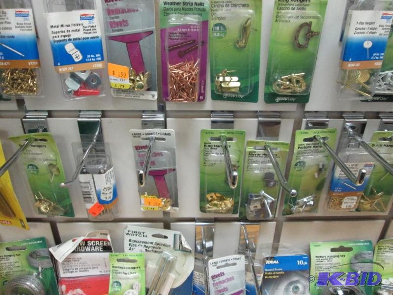 lot 204 image: various sized nails, utility hooks, zip it an...
