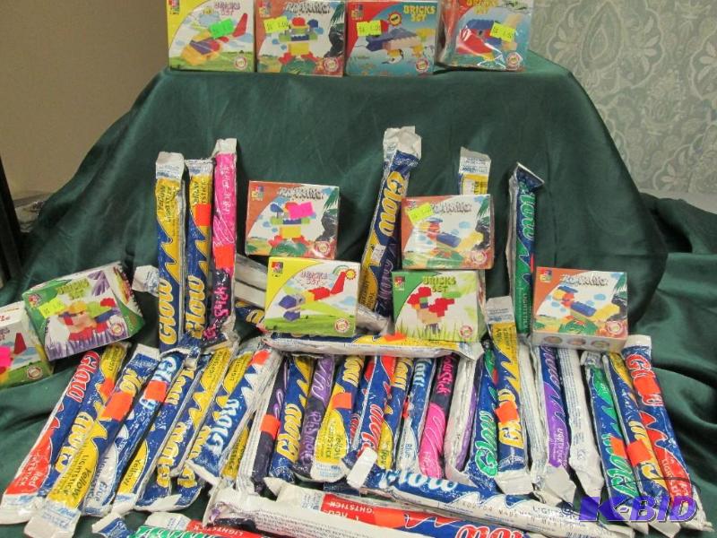 lot 253 image: neon colored glo sticks, woma bricks set...
