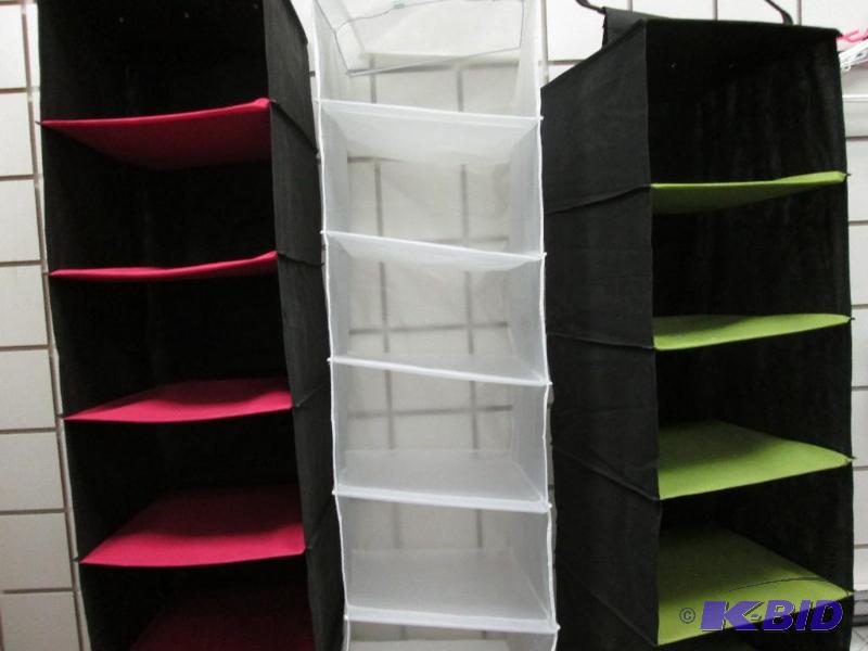 lot 315 image: three hanging canvas and plastic shelves...