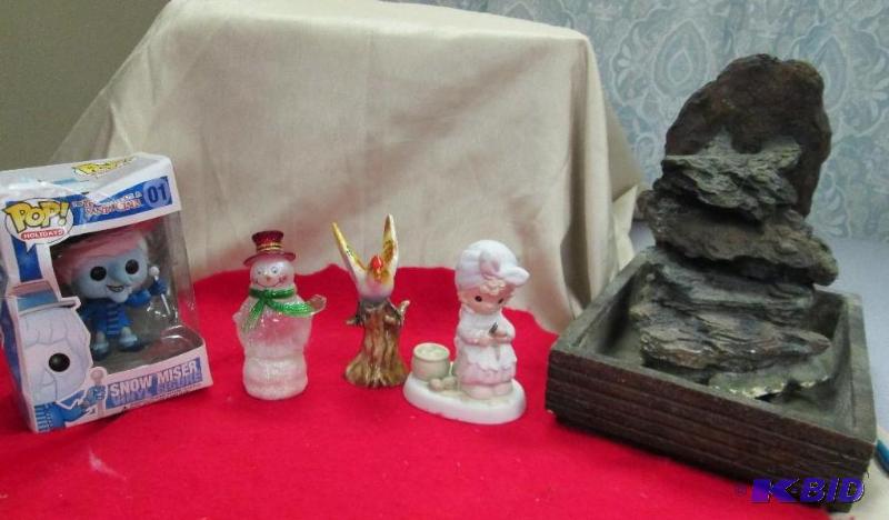 lot 55 image: A figurine of Snow Miser, a bird on a tree tr...