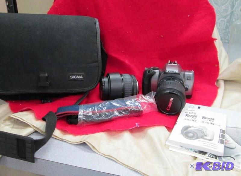 lot 70 image: Canon EOS Rebel K2 and another lens is a Sigm...