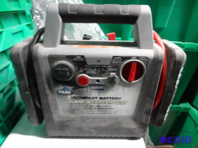 lot 255 image: Used Peak brand compact battery jump starter ...