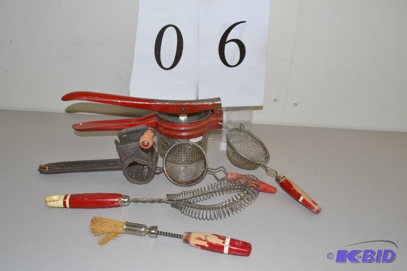 lot 6 image: Red handle kitchen utensils