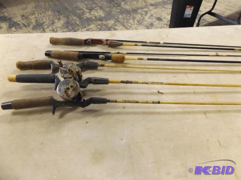 lot of fishing rods, two of them have reels...